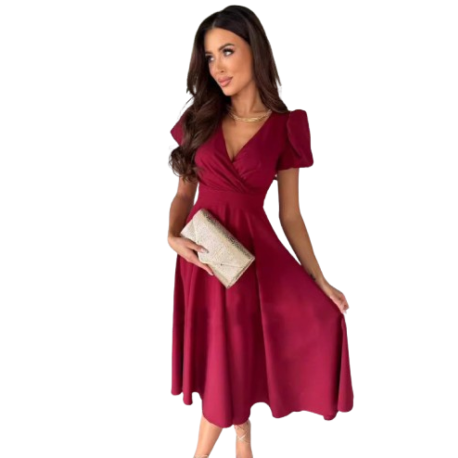 Élégante et fluide. Cette robe bordeaux à la coupe évasée et au décolleté en V, avec des manches bouffantes, est parfaite pour des occasions élégantes. Accessoirisée avec un sac à main doré, elle apporte une touche chic et féminine.