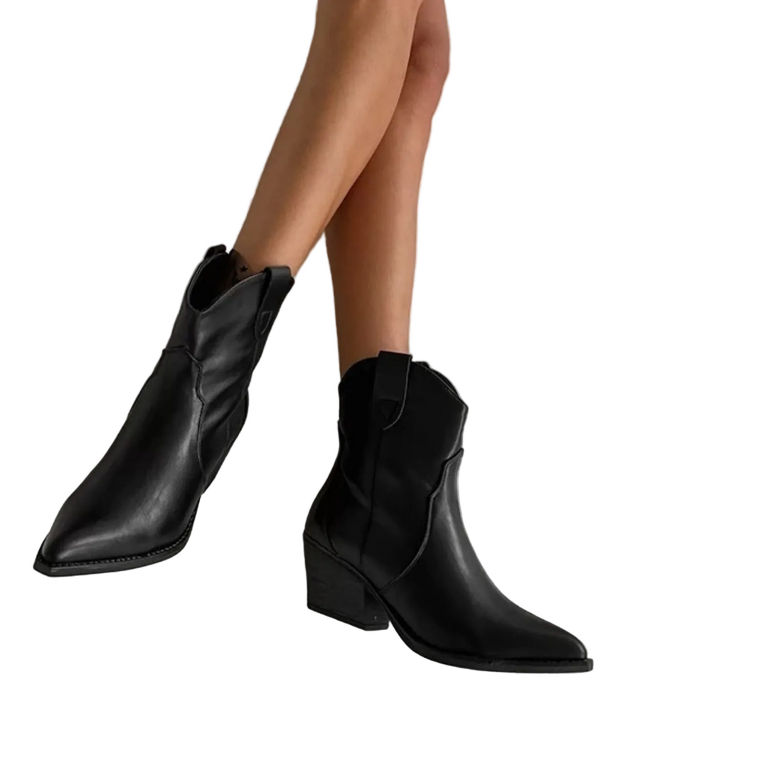 Bottes de cowboy noires en cuir imperméable pour femme, à talon bas et bout pointu. Élégantes et confortables, ces bottes ajoutent une touche de style et de praticité à votre tenue.