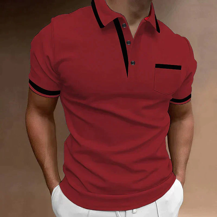 Ce polo rouge pour homme, avec ses détails noirs au col et aux manches, offre un mélange parfait de confort et de style. La poche discrète ajoute une touche élégante, tout en restant pratique. Ce polo est idéal pour les moments décontractés ou plus formels, offrant un look moderne et sophistiqué en toute occasion.