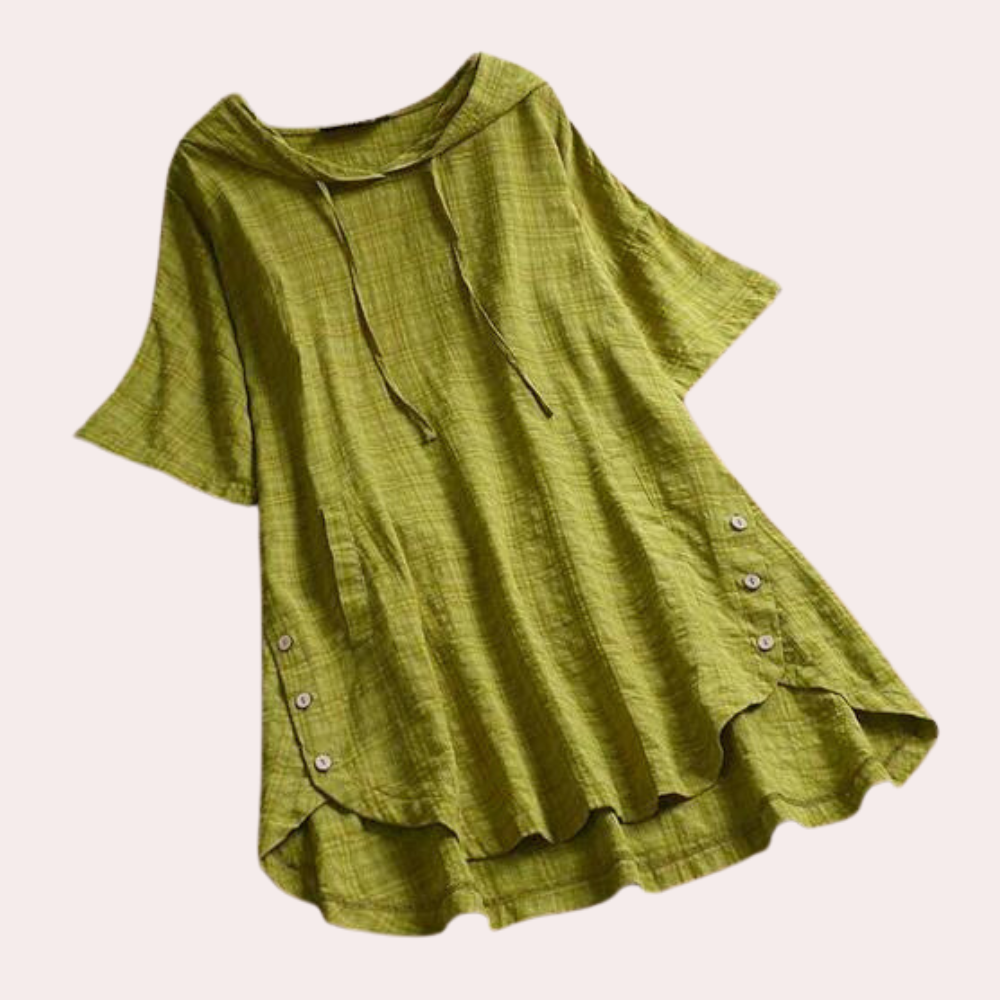 Tunique Frida pour femme, légère et confortable, coupe ample à manches courtes, coloris vert avec détails boutonnés et tissu texturé, parfaite pour un style décontracté et élégant.