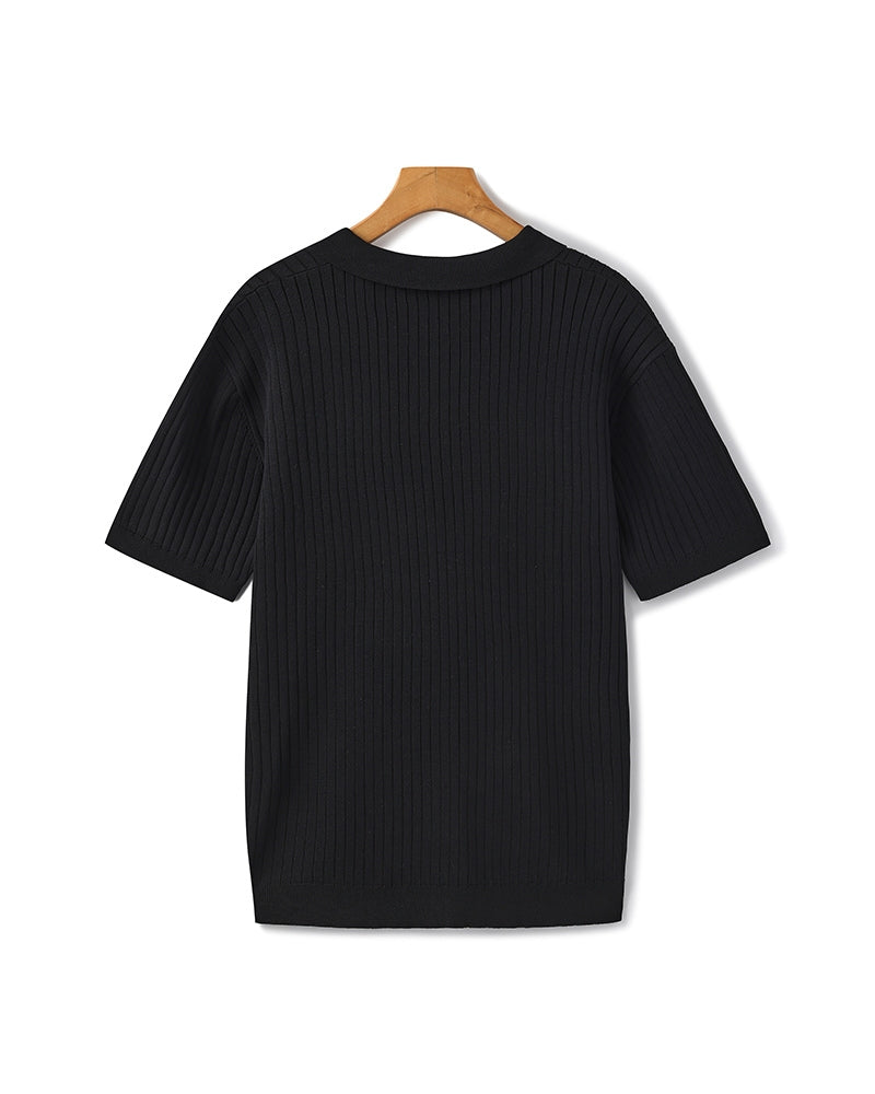 Polo homme Jonas noir à manches courtes avec texture côtelée et finition soignée, offrant un style élégant et confortable au quotidien.