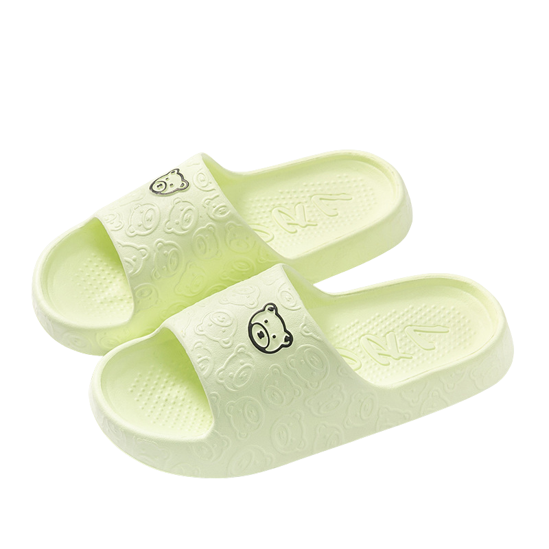 Chaussons femme Kyara jaune pâle, avec un design ludique de têtes de petits ours sur la bande, offrant confort et style pour se détendre à la maison.