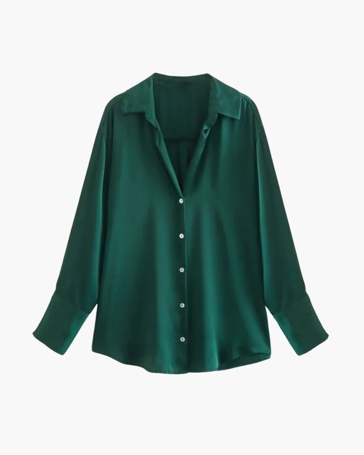 Blouse femme Lana élégante et confortable, coupe fluide à manches longues, coloris vert foncé avec col classique et fermeture boutonnée, parfaite pour un look chic et moderne.