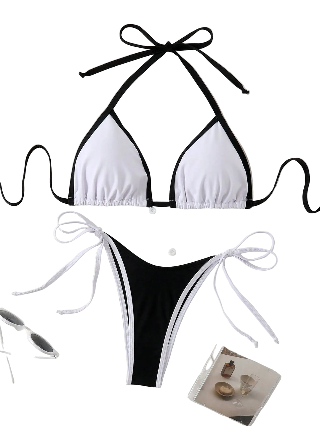 Bikini triangle femme Letty noir et blanc avec liens à nouer, design contrasté et coupe sexy, posé sur une chemise blanche pour un style tendance et confortable.