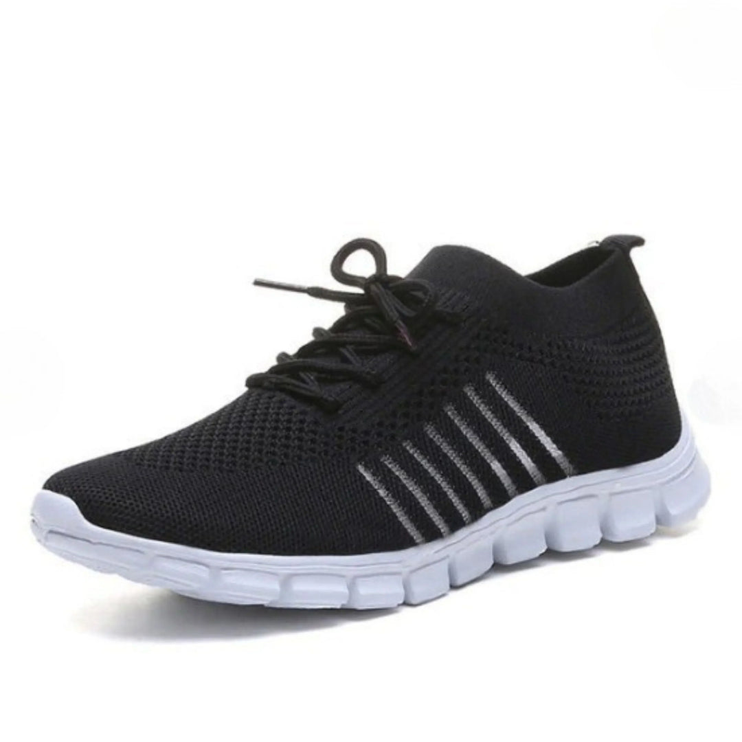 Ces baskets noires pour femmes, avec des détails argentés et une semelle souple, offrent à la fois confort et style moderne pour une allure sportive et élégante.