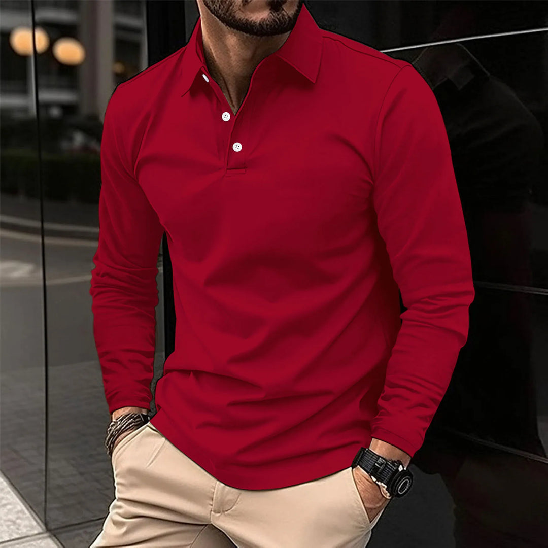Polo à manches longues de couleur rouge vif, avec un col classique et des boutons blancs. Idéal pour un look moderne et dynamique, offrant confort et style pour toutes les occasions.