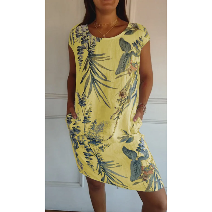 Robe mini en lin Nicolette pour femme, de couleur jaune avec un motif floral élégant. Légère, avec des poches et idéale pour l&
