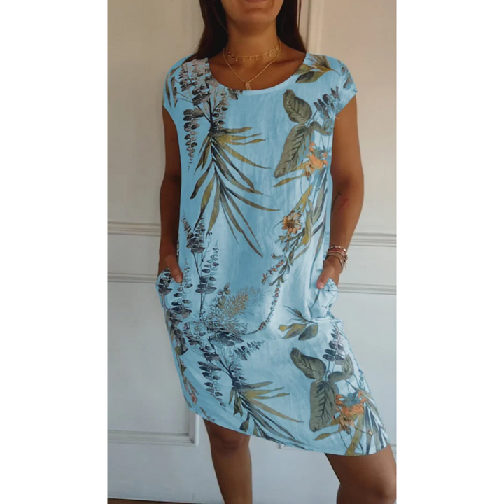 Robe mini en lin Nicolette pour femme, de couleur bleue avec un motif floral élégant. Légère, avec des poches et idéale pour l&