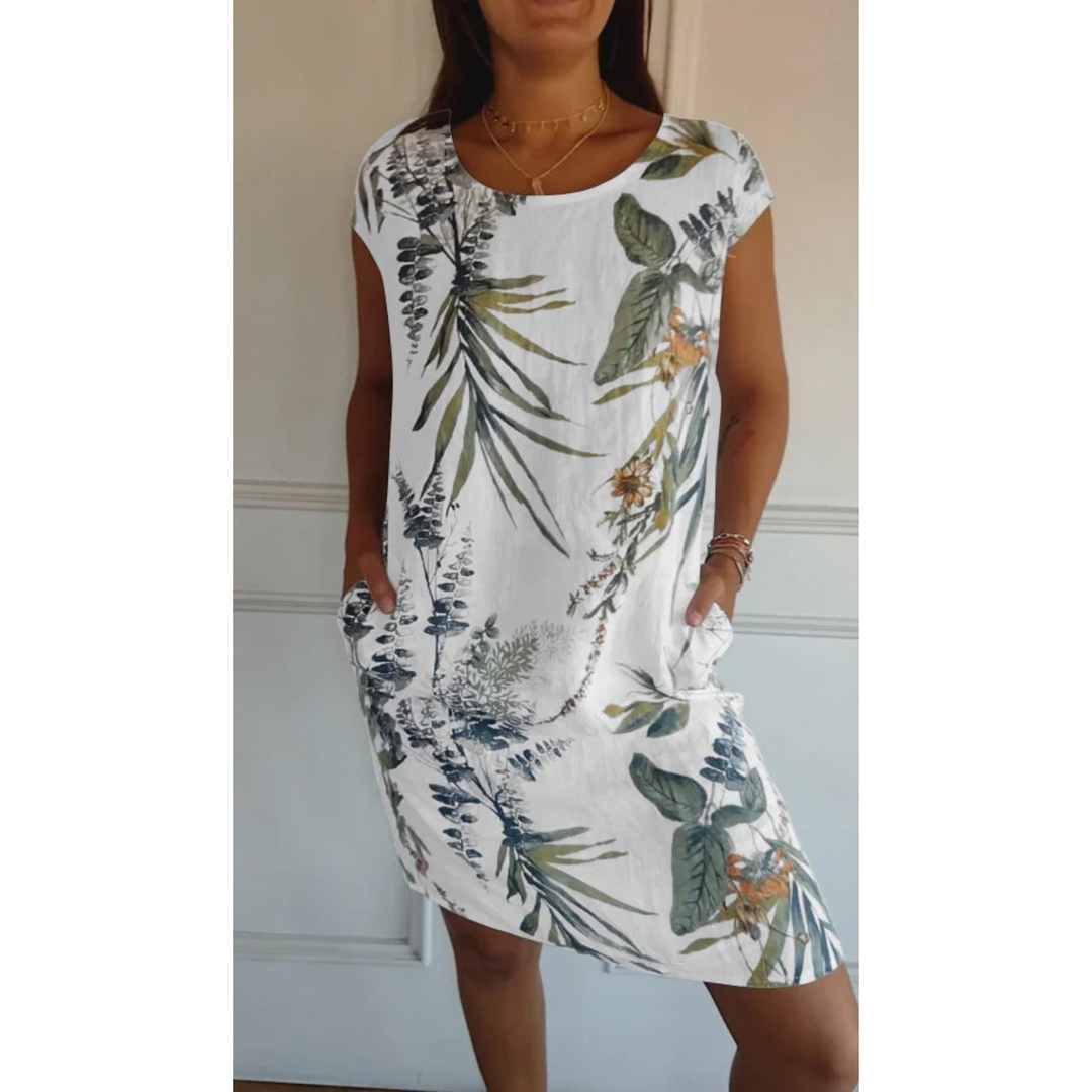 Robe mini en lin Nicolette pour femme, coloris blanc avec motif floral vert et orange. Légère, élégante et idéale pour l&