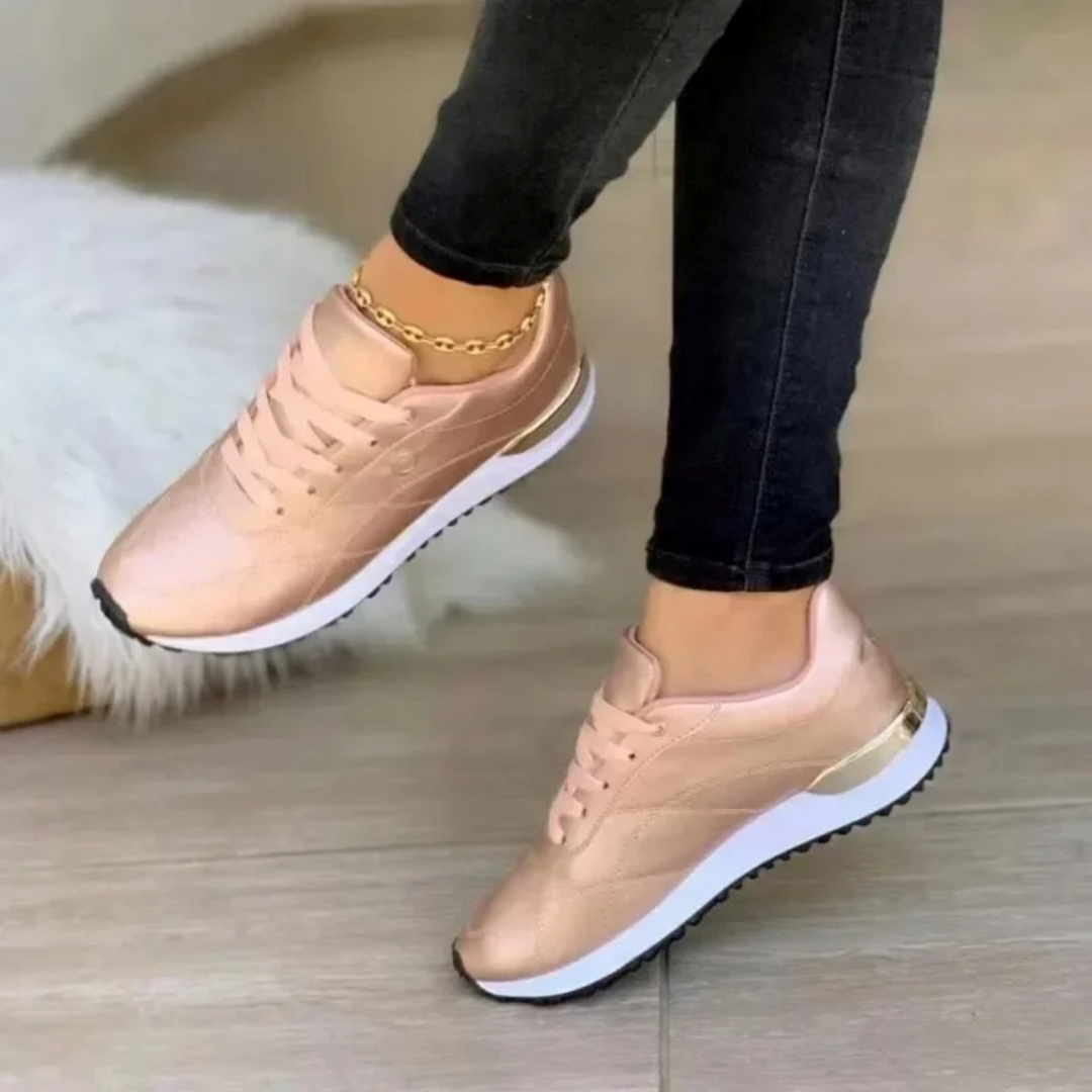 Baskets en cuir rose métallique pour femme, avec une semelle blanche épaisse et des détails métalliques dorés pour une touche d&